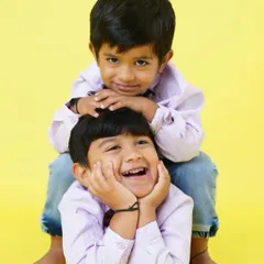 The bond of brotherhood. A playful and loving portrait of two brothers having fun during their studio photoshoot.