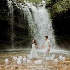 For the adventurous couple, we can explore stunning locations like this waterfall near Puttur. The scale of nature adds a powerful, epic feel to your love story.
