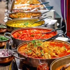 A close-up of our buffet display, highlighting the fresh ingredients and vibrant colors of our dishes. We focus on presentation to make the dining experience as visually appealing as it is delicious.