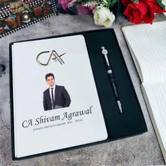 The perfect gift for a Chartered Accountant. This professional set features a personalized A5 diary with a photo and CA logo, along with a custom name pen.