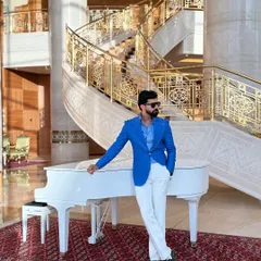 Make a vibrant statement with our electric blue linen blazer. Featuring wide lapels and handcrafted details, this jacket is set against a luxurious backdrop, showcasing a lifestyle of elegance and confidence.