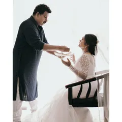 A touching moment between the bride and her father before the ceremony, a memory filled with love and emotion.
