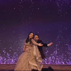 A classic Bollywood pose to end a romantic couple's dance. The sparkling background and their connection made this a picture perfect finale for their sangeet performance.