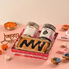The 'Rangmanch' hamper is a vibrant stage of flavors. This customizable box includes a Blueberry Marble tea cake and two jars of our signature eggless cookies.