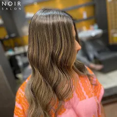 A side view of this stunning cool-toned balayage. The blend of ashy highlights creates a sophisticated and modern look that is perfect for any season.