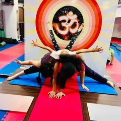 Our kids' yoga classes are full of creativity and teamwork. This three-person pose is a fun way for them to learn about balance and supporting each other.