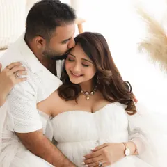 The gentle connection between partners is a beautiful part of the maternity story. Here, a tender forehead kiss captures the love and excitement you share as you wait to meet your little one.