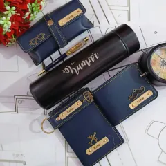 This is one of my most popular gift sets for men, featuring a complete collection of personalized faux leather accessories. It includes a name-engraved wallet, temperature bottle, passport holder, and keychain, all coordinated in a stylish navy blue.