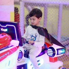Every hero needs a cool ride. This little Batman is ready to save Gotham City on one of our arcade-style bikes.