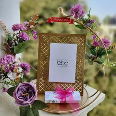 A full-color view of our exquisite cutwork frame, designed for Proposal Day. The gold frame is surrounded by purple flowers and a decorative bird, making it a romantic and memorable gift.