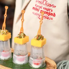 A close-up of our Cheddar Cups, showcasing the vibrant avocado feta topping. We focus on creating bite-sized appetizers that are packed with flavour and visual appeal.