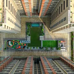 An aerial day-view of "PIXELSCAPES" highlights the clear organization of the master plan, with the vibrant play area and green court acting as the community's social heart.