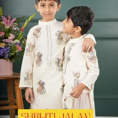 Brotherhood and style go hand-in-hand. This photo shows two brothers in my unique animal-print kurtas, a playful and modern take on traditional wear that is perfect for young boys with big personalities.
