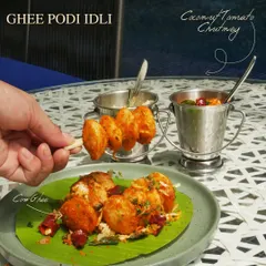 Our new Ghee Podi Idli, served on a banana leaf with coconut and tomato chutney. A modern twist on a South Indian classic.
