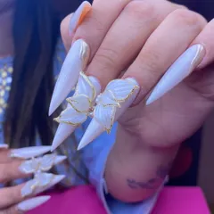 Another view of these stunning 3D butterfly nails, showing how they catch the light. Each butterfly is hand-sculpted, making every set a one-of-a-kind piece of art for your wedding.