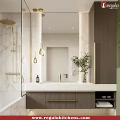 This modern vanity combines a rich wood finish with a clean white countertop. The pendant lighting and gold fixtures add a touch of warmth and luxury to the space.