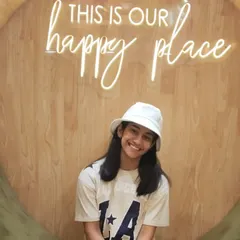 The smile of a happy guest at our signature 'Happy Place' photo spot. I love providing a space where people of all ages can come to relax and feel cherished.