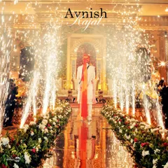 The groom's entrance is a moment of pure spectacle. Here, he makes a grand entry down an aisle lined with flowers and cold pyrotechnics, creating a truly royal and unforgettable photograph.