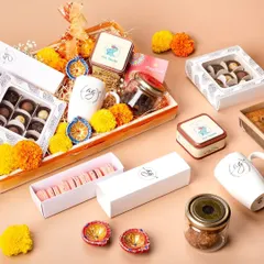 Another look at my gourmet Diwali hamper, showcasing the variety of treats inside. It includes macarons, chocolate bonbons, cookies, and tea, all elegantly arranged for a memorable gift.
