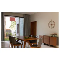 The dining space in the 'Solid Void Solid' house, positioned to overlook a landscaped court. This strategic placement ensures that daily activities are always connected to the outdoors, reinforcing a lifestyle that is in tune with nature.