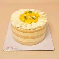 Indulge in the tropical flavors of my Mango Coconut cake. A vanilla sponge is soaked in coconut milk and layered with a coconut cream infused with Malibu rum and fresh mangoes.