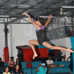 The power and grace of gymnastics captured in a single moment. We train our students in dynamic movements like this split leap, focusing on flexibility, form, and explosive strength.
