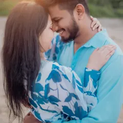 A deeply intimate and romantic close-up. This portrait from a beach pre-wedding shoot focuses solely on the couple's connection, shutting out the rest of the world.