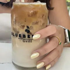 My iced coffee perfectly complements my pearly butter yellow nails.