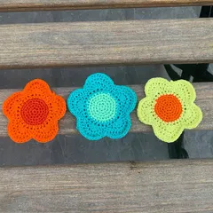 A set of three vibrant flower coasters, perfect for adding a pop of color to your table. I can make these in any color palette to match your home decor.