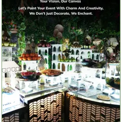 An artistic fruit and dessert station designed with mirrored surfaces and geometric patterns. The multi-level display adds depth and makes the colourful spread even more enticing.