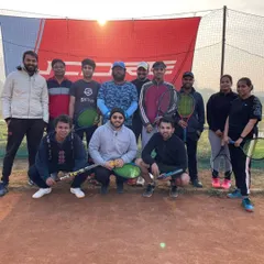 Our adult batch enjoying a crisp morning session on the clay court. Tennis is a lifelong sport, and we've built a fantastic community of players who come here to improve their skills, stay fit, and connect with friends.