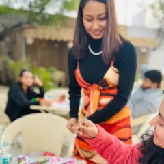 A close-up of me guiding a participant during a painting session. I'm here to help with techniques, color mixing, or just to give a little encouragement. No experience is needed, just an open mind.