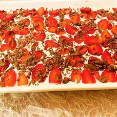 Celebrating the season with my special Strawberry Banoffee Pie. It's a delicious twist on the classic, topped with fresh strawberries and chocolate shavings.