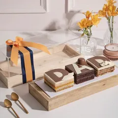 For the one who takes the cake, quite literally. Our special Father’s Day dessert bar comes in an elegant wooden tray with a clear lid, ready for gifting.