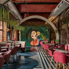 We love creating a mood. This painterly mural of a woman with a peacock became the stunning centerpiece for this restaurant's interior. It demonstrates our skill in creating sophisticated, atmospheric art that elevates the entire dining experience.