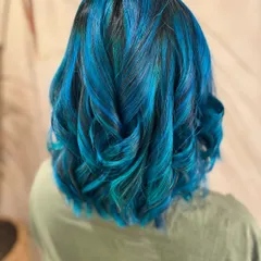 Embracing the inner mermaid with this stunning blue hair. I created this look with a mix of different blue tones on a long bob, which required bleach for that intense color payoff.