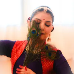 Exploring the art of 'Abhinaya' or expression. This portrait, themed around Lord Krishna, uses the iconic peacock feather to evoke a sense of devotion and storytelling, which is central to my performance philosophy.