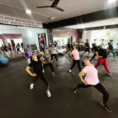 The group in the middle of a dance aerobics routine. It's a full-body workout that feels like dancing with friends.