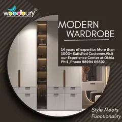 This design shows how a wardrobe can be a complete storage solution. It features a mix of closed cabinets, drawers, and an open, lit-up glass shelf for display, along with an integrated dressing table area.