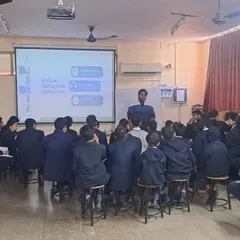 A trainer addresses a group of students in a computer lab. Our workshops are highly interactive, encouraging questions and active participation from all students.