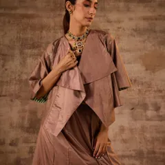This look from a recent festive campaign showcases modern layering with Indian wear. I paired a draped, layered jacket with a matching set, accessorized with a statement polki necklace to add a touch of traditional grandeur.