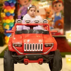 Capturing the fun of a first birthday party, complete with a grand entrance in a toy car. We document all the playful details and activities that make the day special for your child.