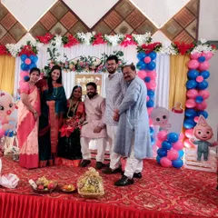 A lovely group photo with the parents-to-be and their family on stage at a baby shower. I love bringing families together to celebrate these precious milestones.