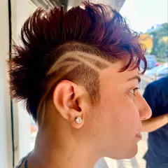 Another angle of the artistic hair tattoo, showing the clean lines and intricate design. This is a great way to add a personal touch to a short haircut.