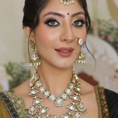 Radiant and elegant, the perfect look for the big day. This close up shows the detailed eye makeup, with a soft brown smokey eye and a sharp wing.