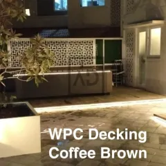This view shows the expanse of the WPC deck, creating a large, usable outdoor area perfect for entertaining. The material is splinter-free and safe for bare feet.