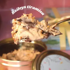A spoonful of heaven featuring our Baileys Tiramisu Dream Cake. This indulgent dessert is layered with rich coffee, creamy mascarpone, and a hint of Baileys for a grown-up treat.