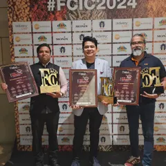 Me and my partners proudly posing with our three awards from FCIC 2024.