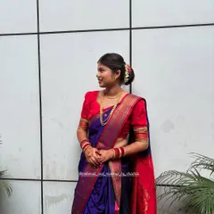 A side view showcasing the traditional hairstyle and the clean lines of the Nauvari drape. My goal is to create a polished and authentic look.