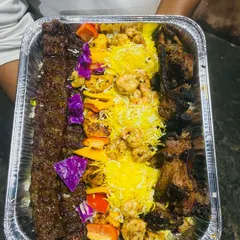 A glimpse of our exquisite Turkish Platter, a vibrant and flavorful assortment of grilled meats, kebabs, and fresh accompaniments. It's a perfect centerpiece for any gathering, offering a unique culinary journey.